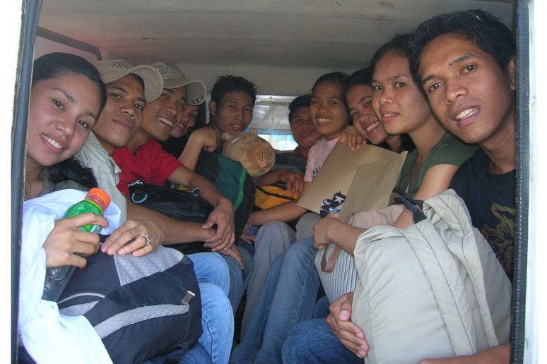 Some of the students crammed at the back of the truck like Sardines. This condition didn&rsquo;t stop them from smiling though.